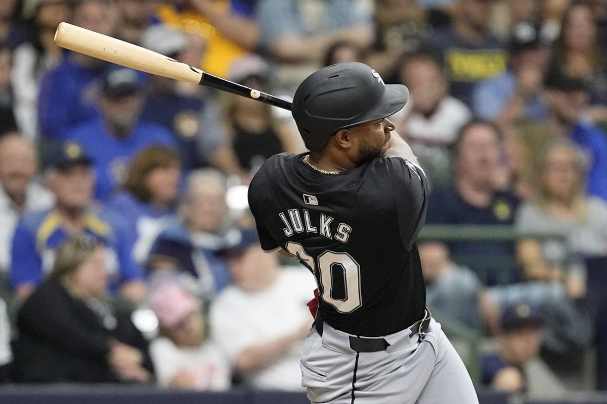 May 31, 2024; Milwaukee, Wisconsin, USA;  Chicago White Sox right fielder Corey Julks (30) hits an RBI double during the third inning against the Milwaukee Brewers at American Family Field. Mandatory Credit: Jeff Hanisch-USA TODAY Sports