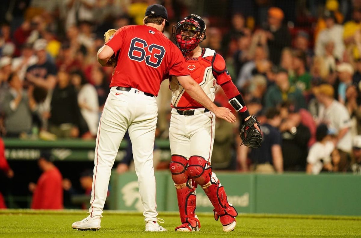 May 31, 2024; Boston, Massachusetts, USA; Boston Red Sox catcher Connor Wong (12) congratulates relief pitcher Justin Slaten (63) after a third strike ending the game against the Detroit Tigers in nine innings at Fenway Park. Mandatory Credit: David Butler II-USA TODAY Sports