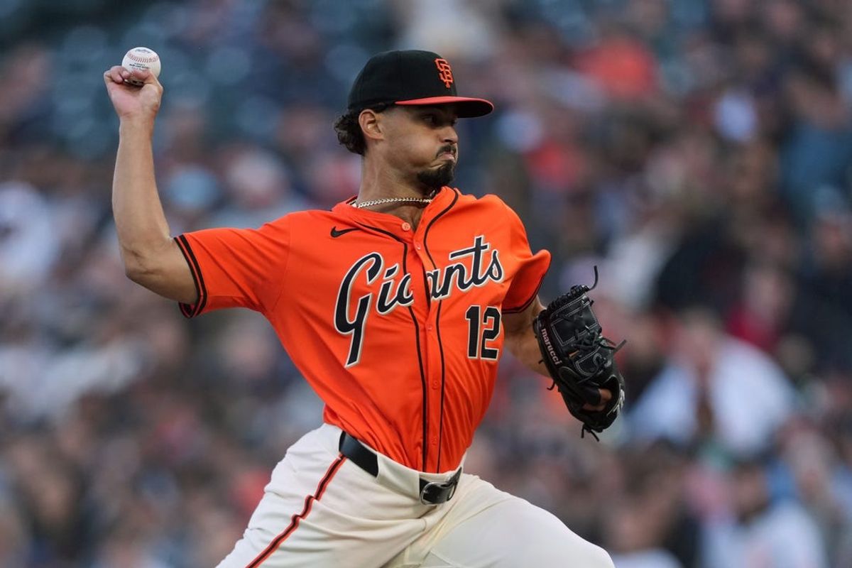 May 31, 2024; San Francisco, California, USA; San Francisco Giants starting pitcher Jordan Hicks (12) throws a pitch against the New York Yankees during the first inning at Oracle Park. Mandatory Credit: Darren Yamashita-USA TODAY Sports