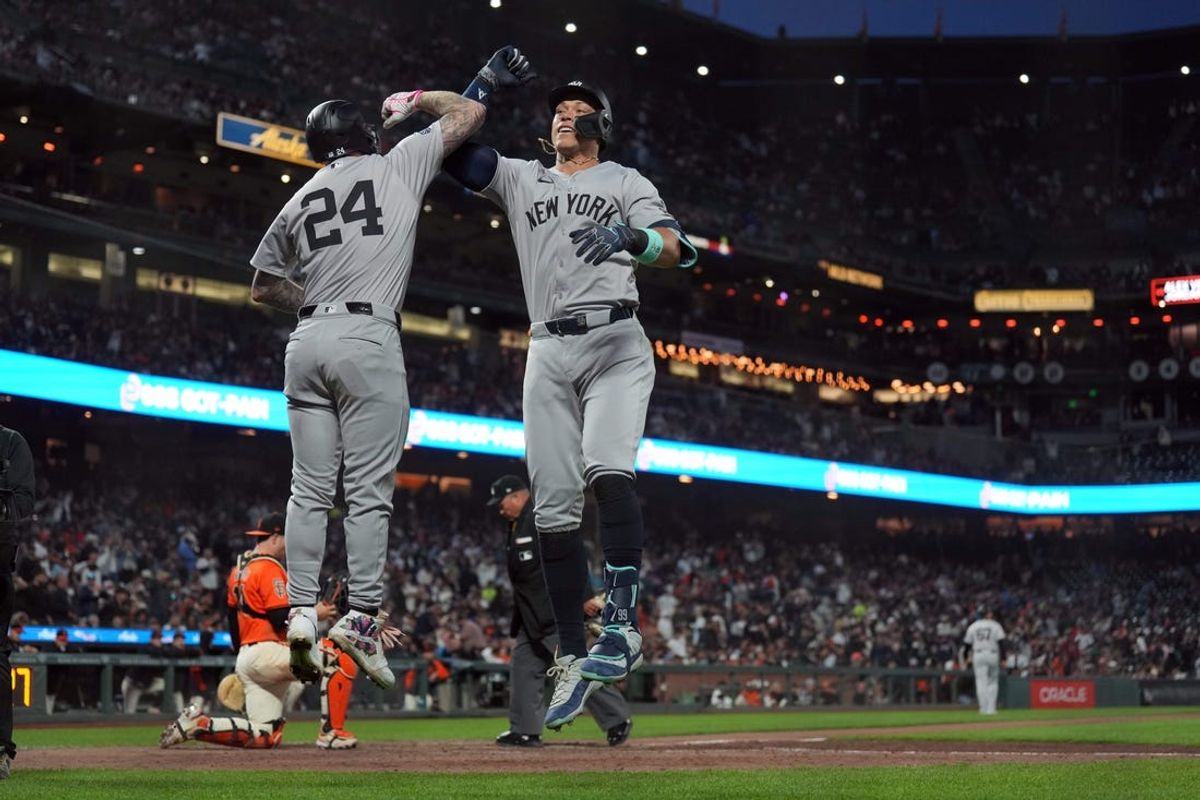 May 31, 2024; San Francisco, California, USA; New York Yankees designated hitter Aaron Judge (right) celebrates with left fielder Alex Verdugo (24) after hitting a home run against the San Francisco Giants during the sixth inning at Oracle Park. Mandatory Credit: Darren Yamashita-USA TODAY Sports
