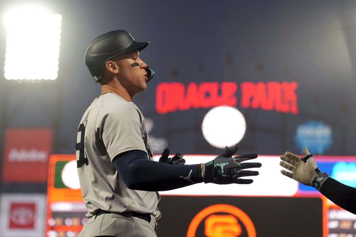 May 31, 2024; San Francisco, California, USA; New York Yankees designated hitter Aaron Judge (left) is congratulated by second baseman Gleyber Torres (not pictured) after hitting a home run against the San Francisco Giants during the sixth inning at Oracle Park. Mandatory Credit: Darren Yamashita-USA TODAY Sports