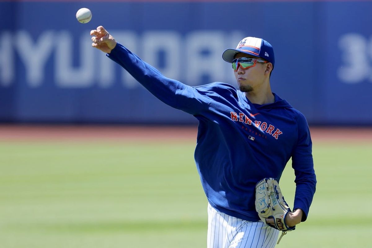 Jun 1, 2024; New York City, New York, USA; New York Mets injured starting pitcher Kodai Senga (34) throws a baseball in the outfield before a game against the Arizona Diamondbacks at Citi Field. Mandatory Credit: Brad Penner-USA TODAY Sports
