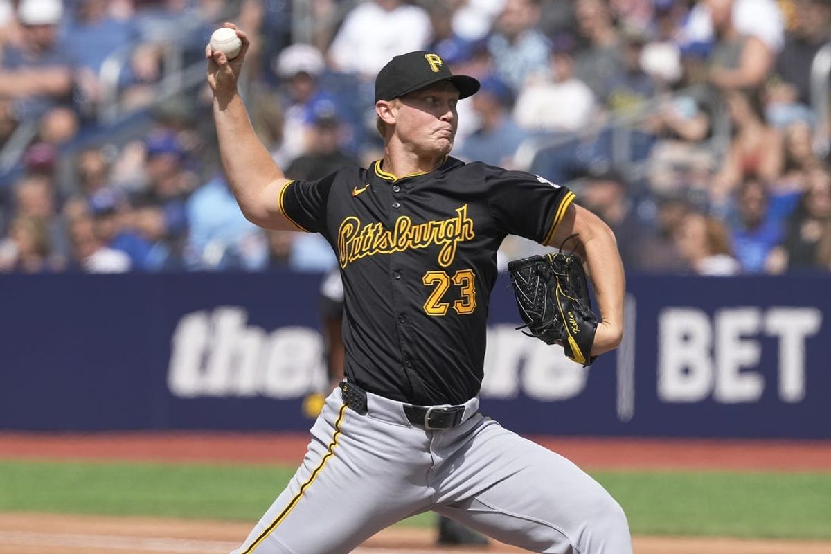 Jun 1, 2024; Toronto, Ontario, CAN;  Pittsburgh Pirates starting pitcher Mitch Keller (23) throws against the Toronto Blue Jays during the second inning at Rogers Centre. Mandatory Credit: John E. Sokolowski-USA TODAY Sports