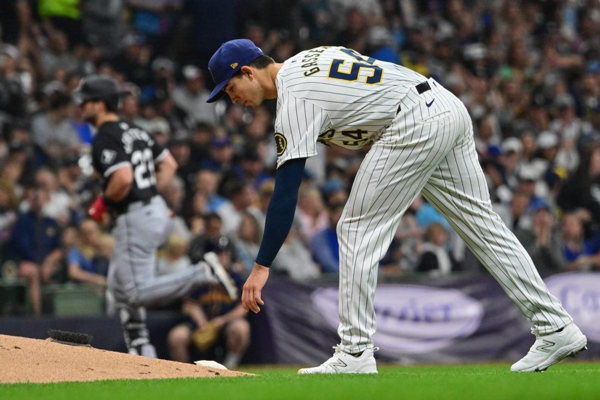 Jun 1, 2024; Milwaukee, Wisconsin, USA;  Milwaukee Brewers starting pitcher Robert Gasser (54) waits for Chicago White Sox left fielder Andrew Benintendi (23) to finish running the bases after hitting a solo home run in the third inning at American Family Field. Mandatory Credit: Benny Sieu-USA TODAY Sports