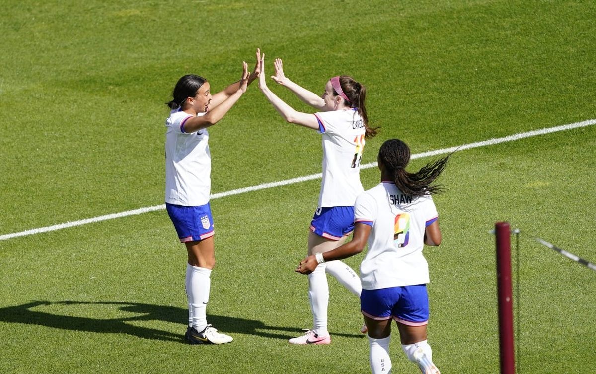 Jun 1, 2024; Commerce City, Colorado, USA;  Mallory Swanson (left) celebrates her second goal with Rose Lavelle at Dick's Sporting Goods Park. Mandatory Credit: Michael Madrid-USA TODAY Sports