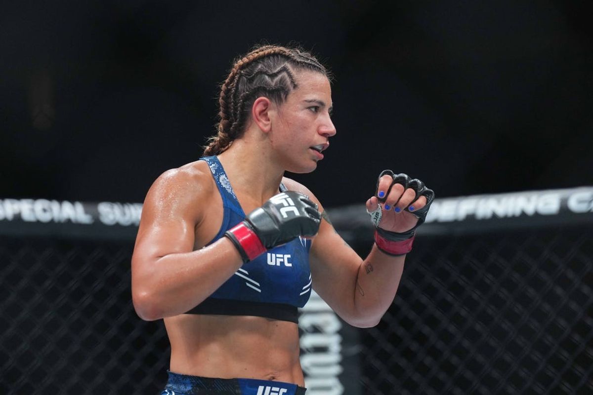 Jun 1, 2024; Newark, New Jersey, USA; Ailin Perez (red gloves) fights Joselyne Edwards (blue gloves) during UFC 302 at Prudential Center. Mandatory Credit: Joe Camporeale-USA TODAY Sports