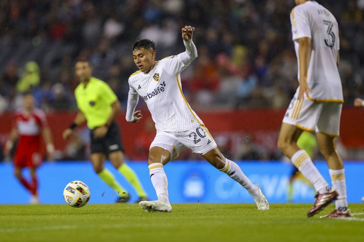 Jun 1, 2024; Chicago, Illinois, USA; LAFC midfielder Eduard Atuesta (20) dribbles the ball during the first half at Soldier Field. Mandatory Credit: Melissa Tamez-USA TODAY Sports