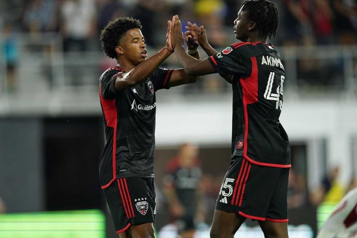 Jun 1, 2024; Washington, District of Columbia, USA; D.C. United forward Kristian Fletcher (27) and defender Matai Akinmboni (45) react after the game against Toronto FC at Audi Field. Mandatory Credit: Amber Searls-USA TODAY Sports