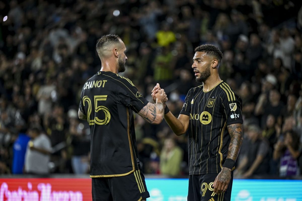 Jun 1, 2024; Los Angeles, California, USA; LAFC forward Denis Bouanga (99) celebrates with his teammates after scoring a goal during the second half at BMO Stadium. Mandatory Credit: Jonathan Hui-USA TODAY Sports