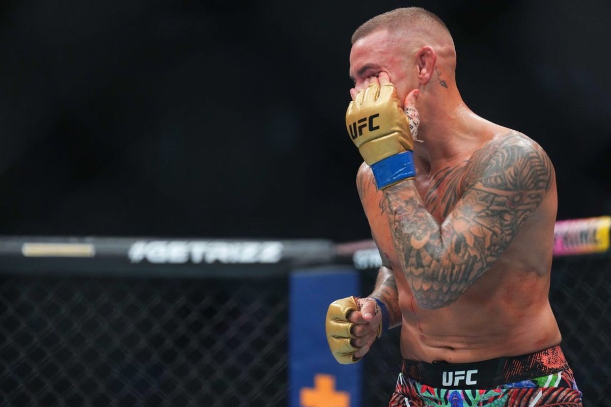 Jun 1, 2024; Newark, New Jersey, USA; Islam Makhachev (red gloves) fights Dustin Poirier (blue gloves) during UFC 302 at Prudential Center. Mandatory Credit: Joe Camporeale-USA TODAY Sports