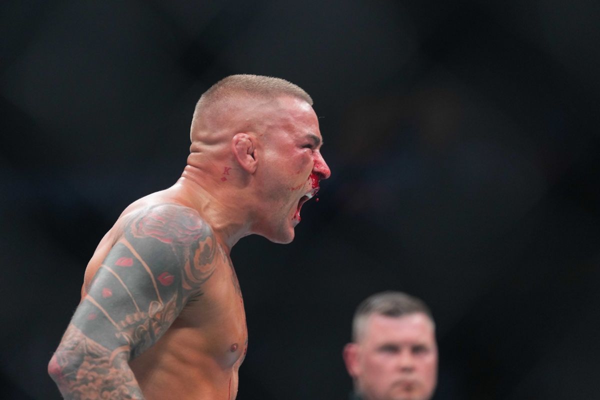 Jun 1, 2024; Newark, New Jersey, USA; Dustin Poirier (blue gloves) reacts during the fight against Islam Makhachev (red gloves) during UFC 302 at Prudential Center. Mandatory Credit: Joe Camporeale-USA TODAY Sports
