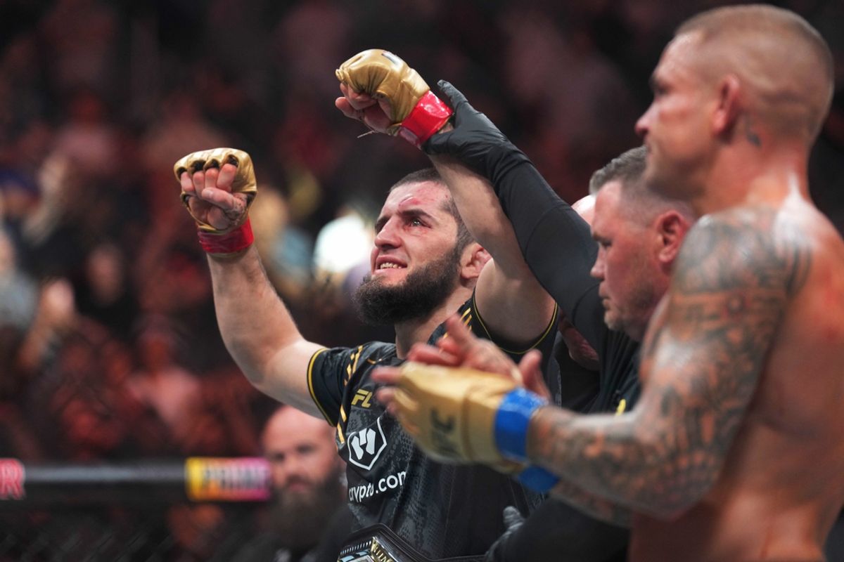 Jun 1, 2024; Newark, New Jersey, USA; Islam Makhachev (red gloves) celebrates defeating Dustin Poirier (blue gloves) during UFC 302 at Prudential Center. Mandatory Credit: Joe Camporeale-Imagn Images