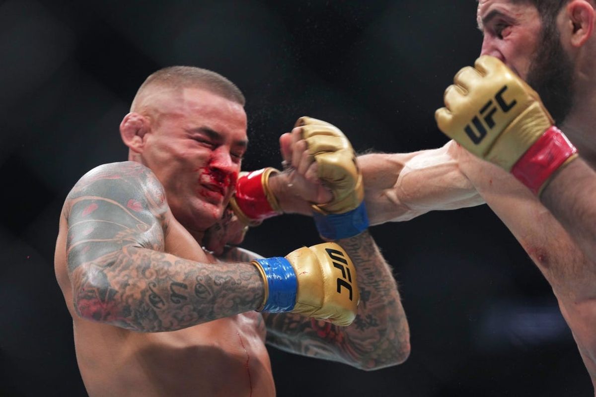 Jun 1, 2024; Newark, New Jersey, USA; Islam Makhachev (red gloves) fights Dustin Poirier (blue gloves) during UFC 302 at Prudential Center. Mandatory Credit: Joe Camporeale-USA TODAY Sports