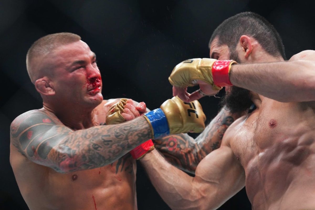 Jun 1, 2024; Newark, New Jersey, USA; Islam Makhachev (red gloves) fights Dustin Poirier (blue gloves) during UFC 302 at Prudential Center. Mandatory Credit: Joe Camporeale-Imagn Images