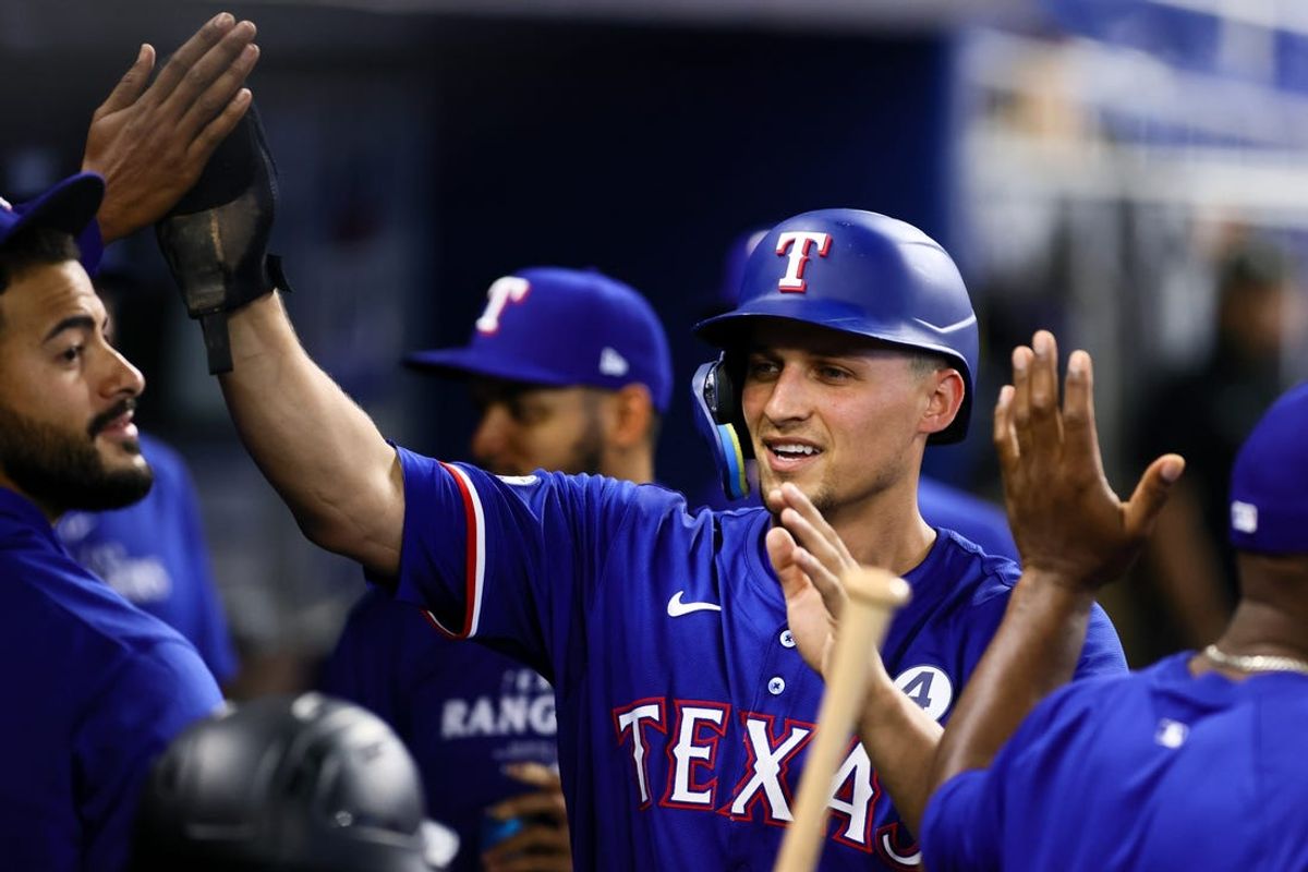 Jun 2, 2024; Miami, Florida, USA; Texas Rangers shortstop Corey Seager (5) celebrates after scoring against the Miami Marlins during the first inning at loanDepot Park. Mandatory Credit: Sam Navarro-USA TODAY Sports