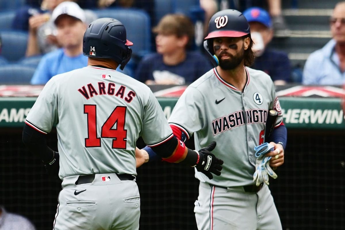 Jun 2, 2024; Cleveland, Ohio, USA; Washington Nationals shortstop Ildemaro Vargas (14) celebrates with left fielder Jesse Winker (6) after scoring during the second inning against the Cleveland Guardians at Progressive Field. Mandatory Credit: Ken Blaze-USA TODAY Sports
