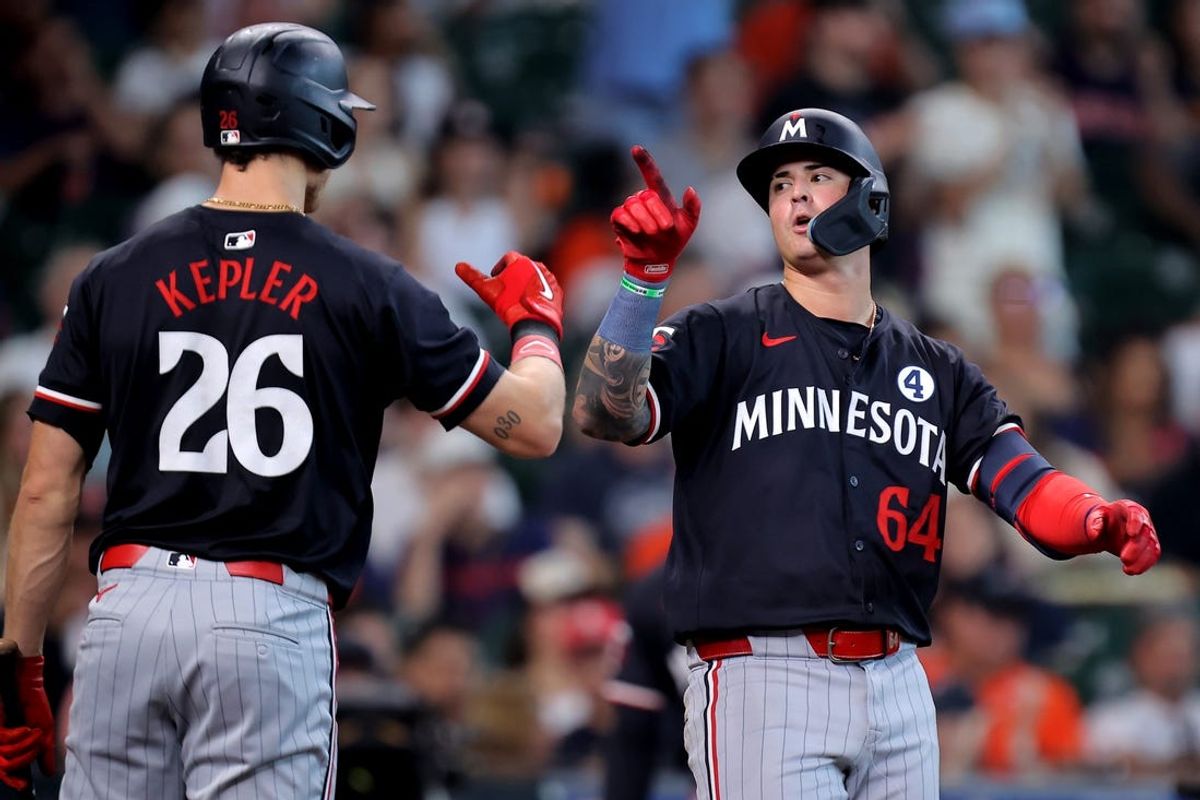 Jun 2, 2024; Houston, Texas, USA; Minnesota Twins third baseman Jose Miranda (64) is congratulated by right fielder Max Kepler (26) after hitting a home run against the Houston Astros during the sixth inning at Minute Maid Park. Mandatory Credit: Erik Williams-USA TODAY Sports