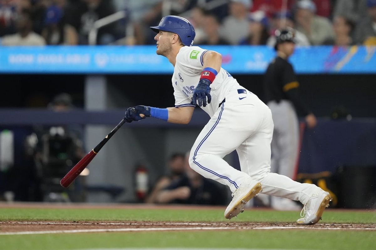 Jun 2, 2024; Toronto, Ontario, CAN; Toronto Blue Jays center fielder Daulton Varsho (25) hits a double against the Pittsburgh Pirates during the third inning at Rogers Centre. Mandatory Credit: John E. Sokolowski-USA TODAY Sports