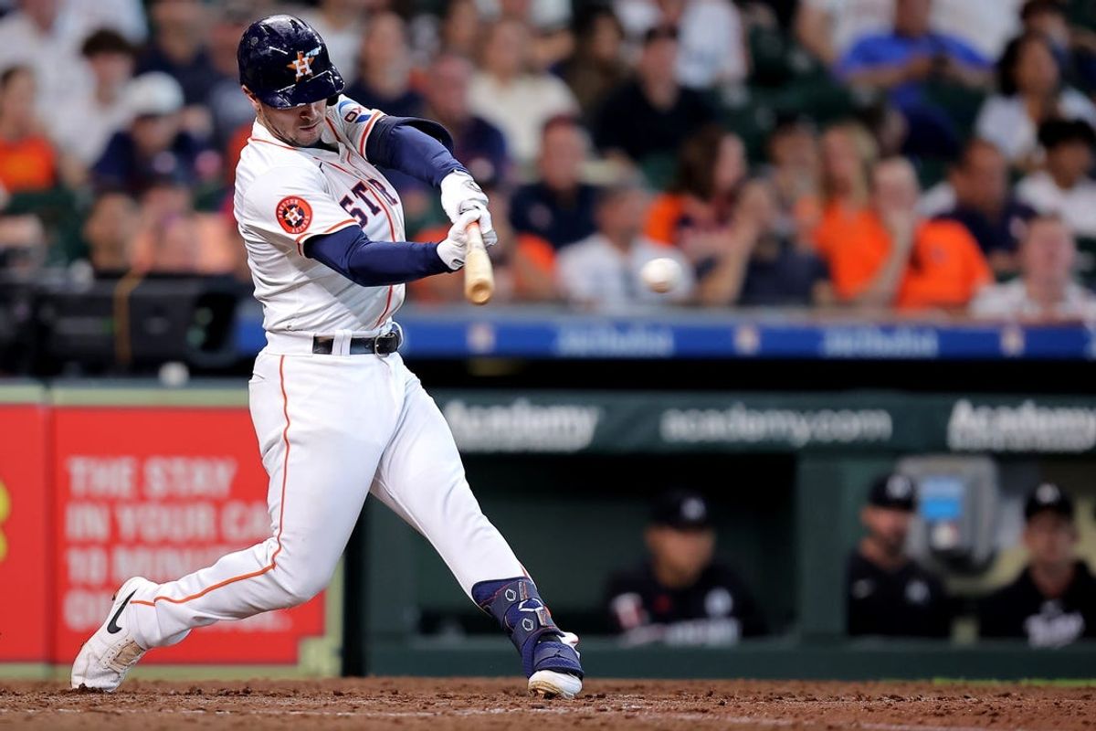 Jun 2, 2024; Houston, Texas, USA; Houston Astros third baseman Alex Bregman (2) hits a single against the Minnesota Twins during the seventh inning at Minute Maid Park. Mandatory Credit: Erik Williams-USA TODAY Sports