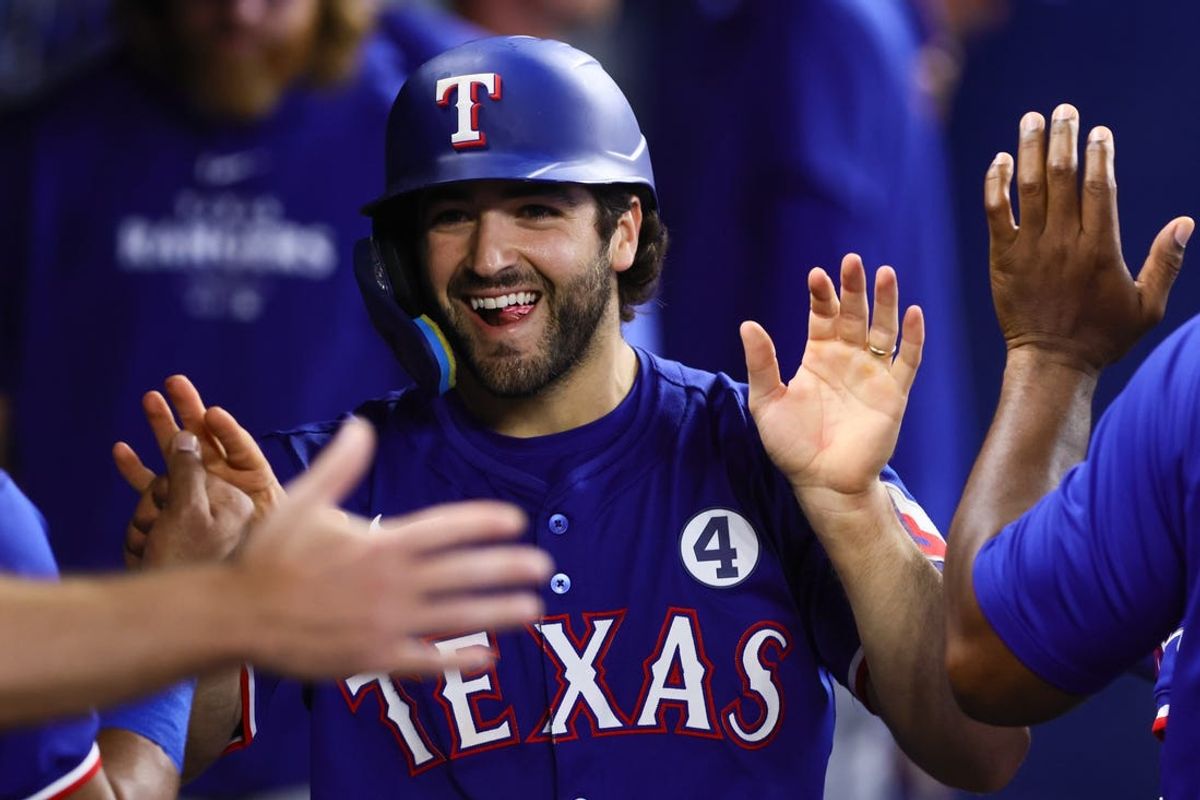 Jun 2, 2024; Miami, Florida, USA; Texas Rangers third baseman Josh Smith (8) celebrates after scoring against the Miami Marlins during the ninth inning at loanDepot Park. Mandatory Credit: Sam Navarro-USA TODAY Sports