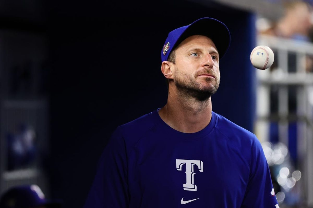 Jun 2, 2024; Miami, Florida, USA; Texas Rangers starting pitcher Max Scherzer (31) looks on from inside the dugout against the Miami Marlins at loanDepot Park. Mandatory Credit: Sam Navarro-USA TODAY Sports