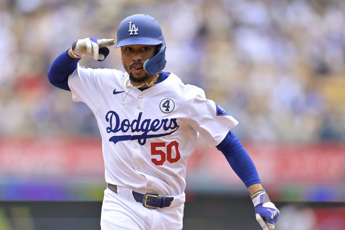 Jun 2, 2024; Los Angeles, California, USA;  Los Angeles Dodgers shortstop Mookie Betts (50) rounds the bases after hitting a solo home run in the first inning against the Colorado Rockies at Dodger Stadium. Mandatory Credit: Jayne Kamin-Oncea-USA TODAY Sports