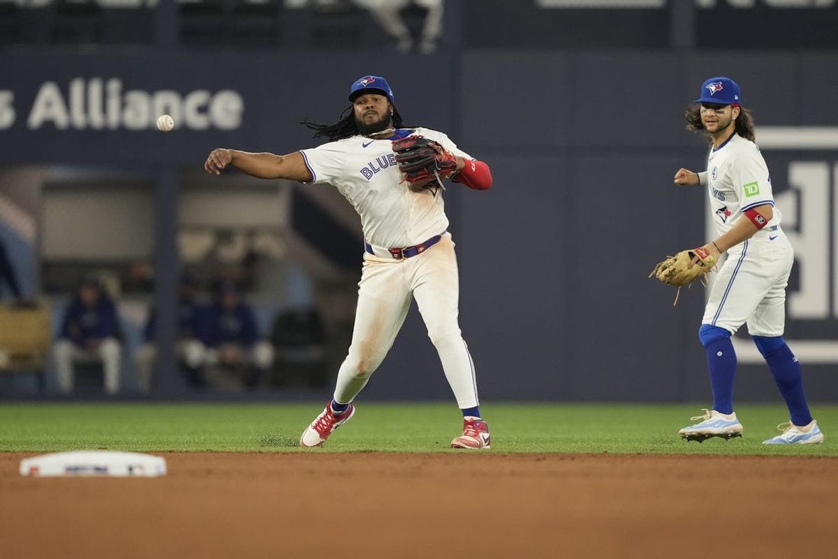 Jun 2, 2024; Toronto, Ontario, CAN; Toronto Blue Jays third baseman Vladimir Guerrero Jr. (27) throws to first base against the Pittsburgh Pirates during the eighth inning at Rogers Centre. Mandatory Credit: John E. Sokolowski-USA TODAY Sports
