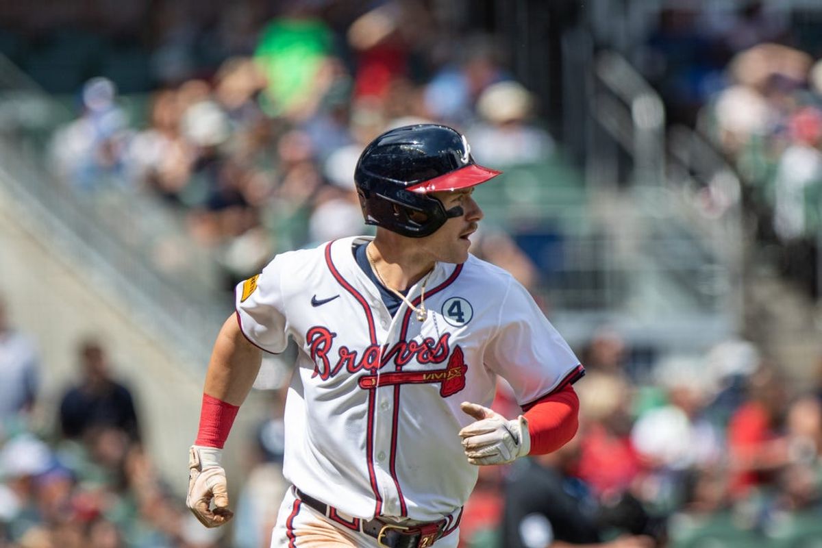 Jun 2, 2024; Cumberland, Georgia, USA;  Atlanta Braves outfielder Jarred Kelenic (24) runs to first base after hitting a ground ball against the Oakland Athletics during the eighth inning at Truist Park. Mandatory Credit: Jordan Godfree-USA TODAY Sports
