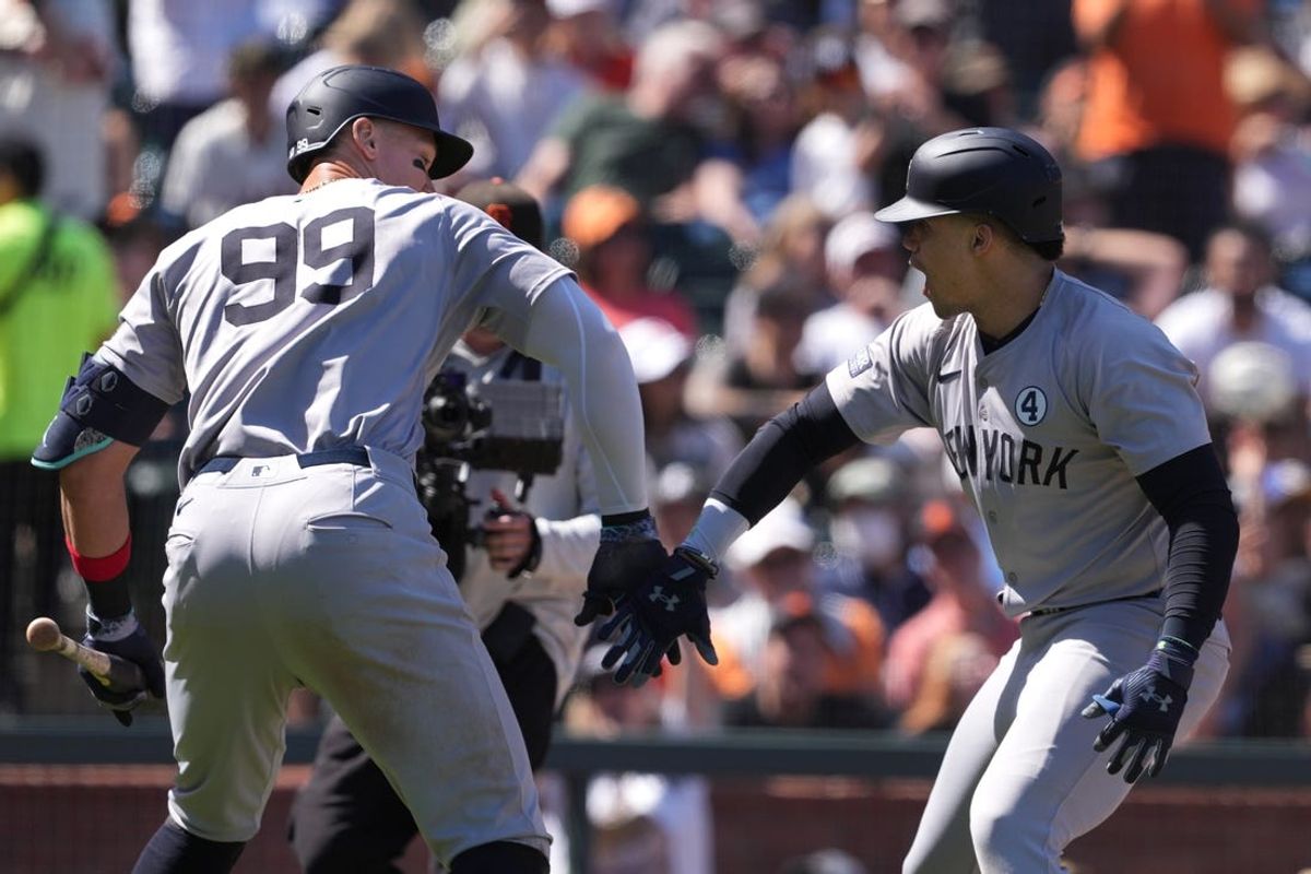 Jun 2, 2024; San Francisco, California, USA; New York Yankees right fielder Juan Soto (right) celebrates with center fielder Aaron Judge (99) after hitting a home run against the San Francisco Giants during the ninth inning at Oracle Park. Mandatory Credit: Darren Yamashita-USA TODAY Sports