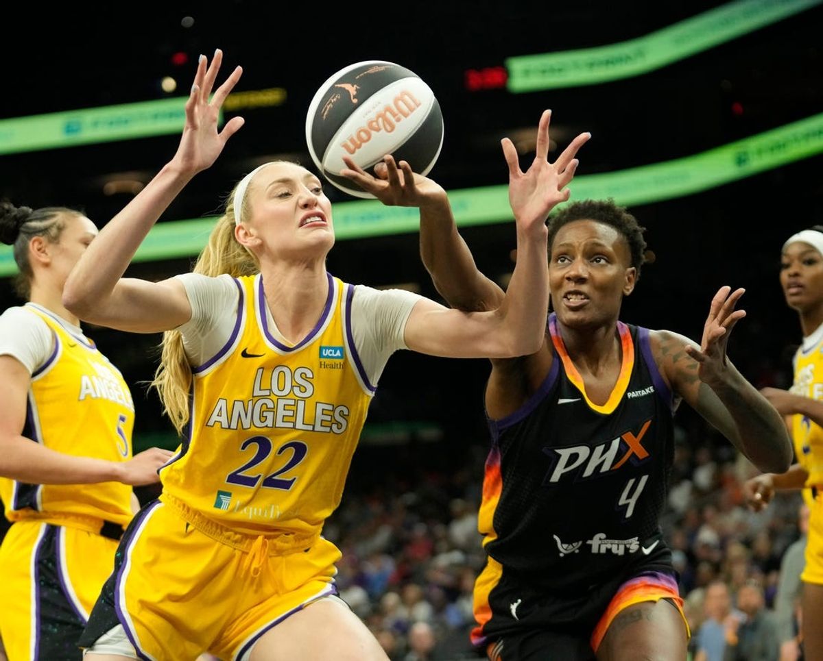 Los Angeles Sparks forward Cameron Brink (22) and Phoenix Mercury forward Natasha Mack (4) battle for a loose ball during the first quarter on Sunday, June 2, 2024, at Footprint Center in Phoenix.