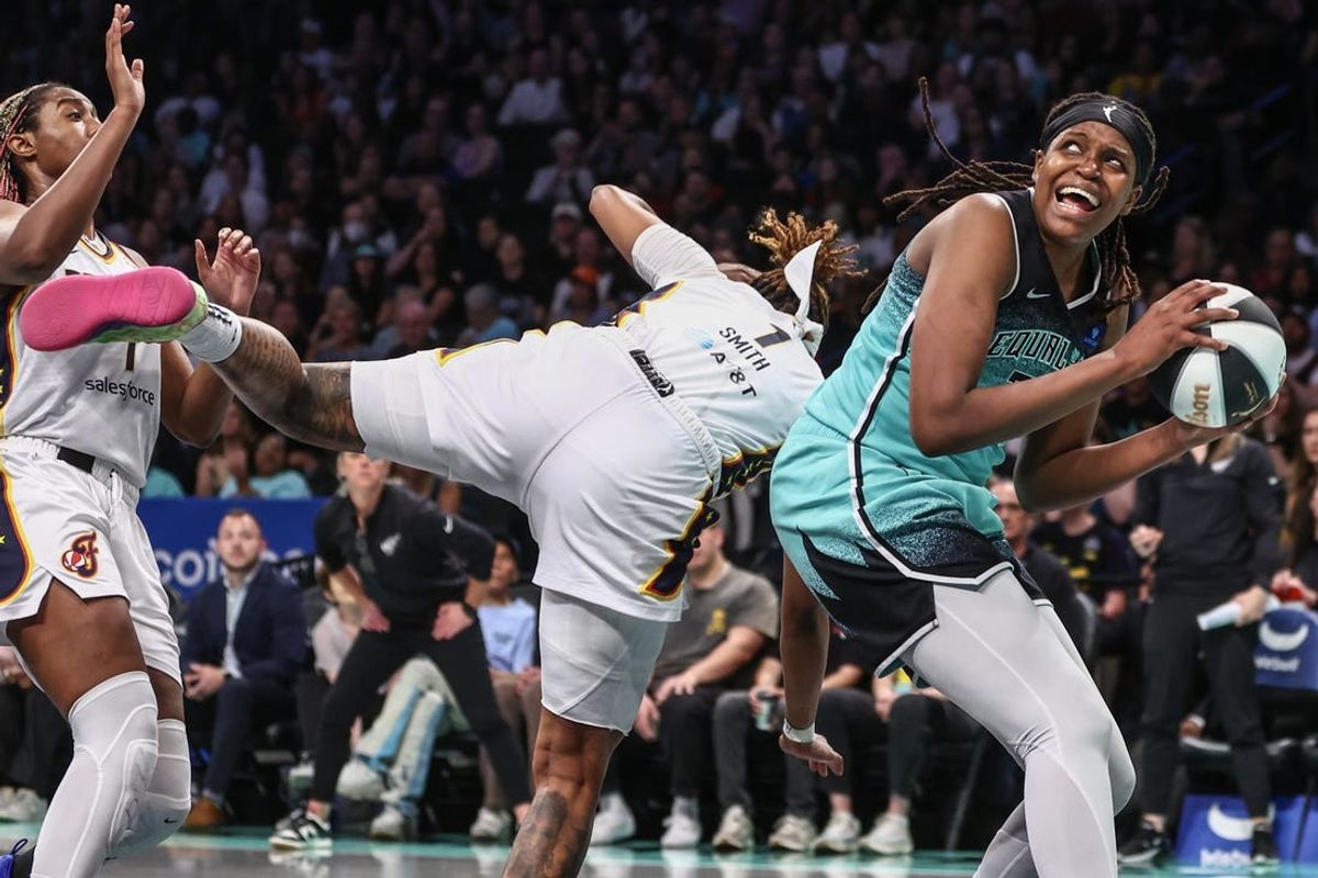 Jun 2, 2024; Brooklyn, New York, USA;  New York Liberty forward Jonquel Jones (35) posts up against Indiana Fever forward NaLyssa Smith (1) in the third quarter at Barclays Center. Mandatory Credit: Wendell Cruz-USA TODAY Sports