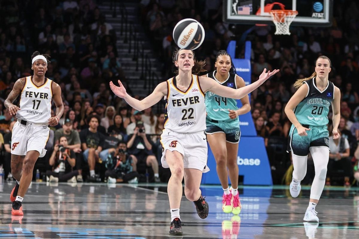 Jun 2, 2024; Brooklyn, New York, USA;  Indiana Fever guard Caitlin Clark (22) reacts after making a pass in the second quarter against the New York Liberty at Barclays Center. Mandatory Credit: Wendell Cruz-USA TODAY Sports