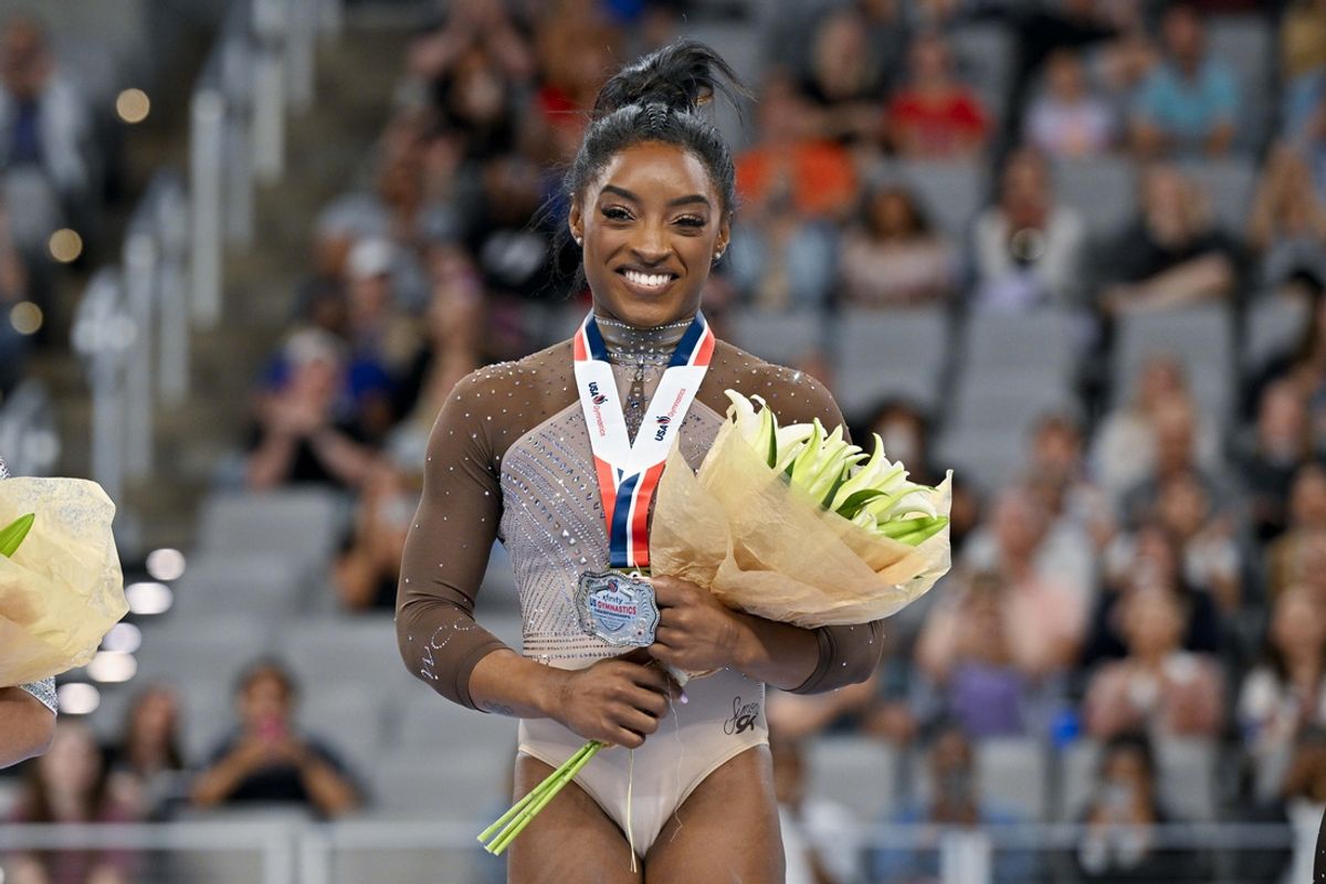 Simone Biles of World Champions Centre poses for a photo with her gold medal and commemorative belt buckle after finishing in first in the women’s 2024 Xfinity U.S. Gymnastics Championships at Dickies Arena. Mandatory Credit: Jerome Miron-USA TODAY Sports
