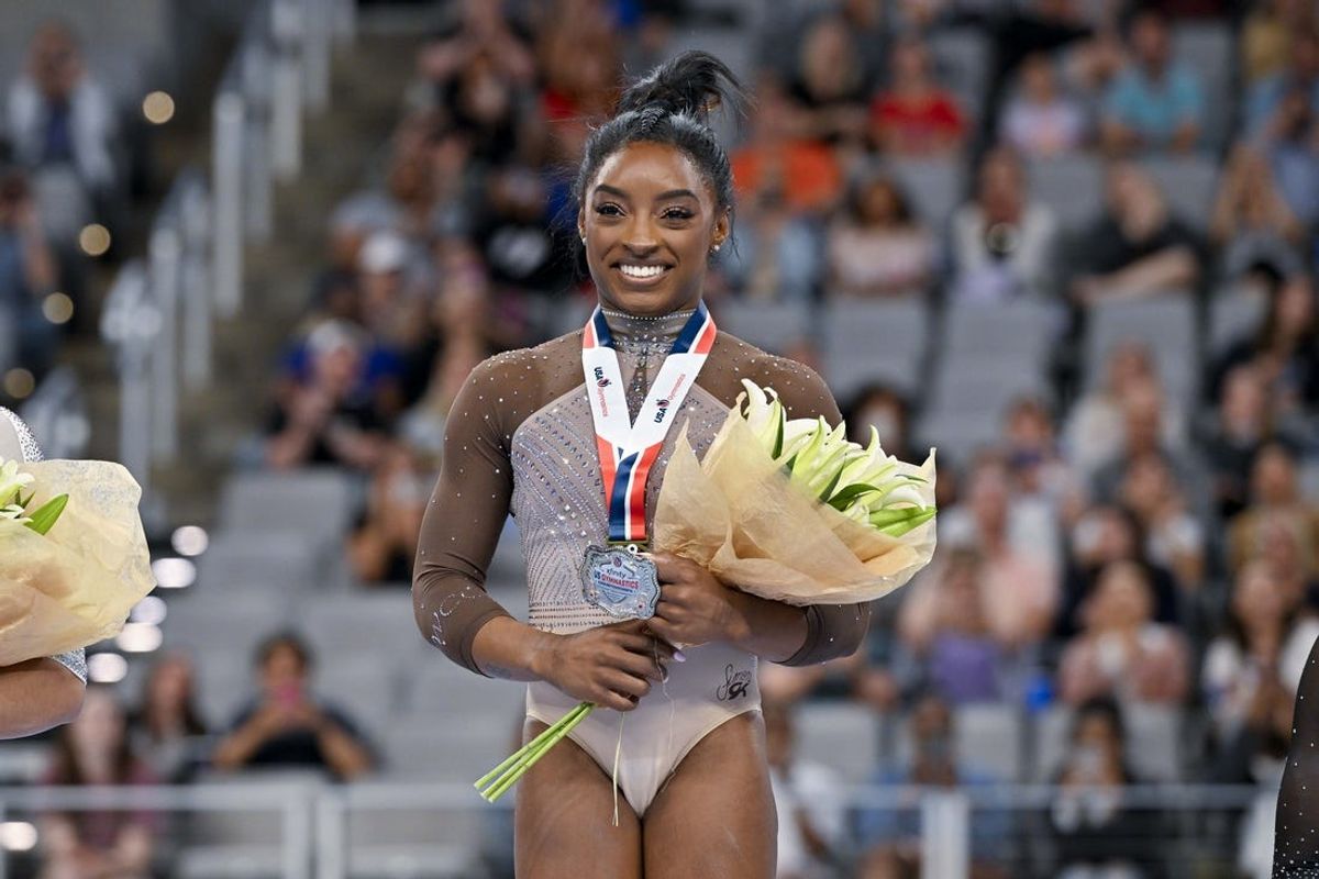Jun 2, 2024; Fort Worth, Texas, USA; Simone Biles of World Champions Centre poses for a photo with her gold medal and commemorative belt buckle after finishing in first in the women’s 2024 Xfinity U.S. Gymnastics Championships at Dickies Arena. Mandatory Credit: Jerome Miron-USA TODAY Sports