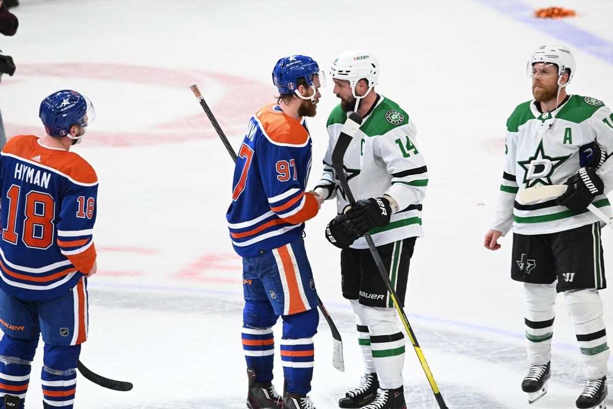 Jun 2, 2024; Edmonton, Alberta, CAN; Oilers centre Connor McDavid (97) shakes hands with Dallas Stars left winger Jamie Benn (14) at the end of the third period in game six of the Western Conference Final of the 2024 Stanley Cup Playoffs at Rogers Place. Mandatory Credit: Walter Tychnowicz-Imagn Images