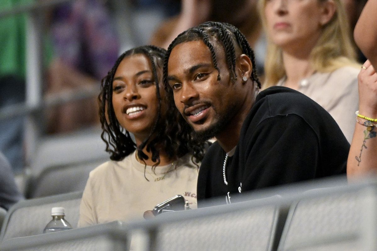 Jun 2, 2024; Fort Worth, Texas, USA; Chicago Bears safety Jonathan Owens watches his wife Simone Biles (not pictured) as she performs during day two of the women’s 2024 Xfinity U.S. Gymnastics Championships at Dickies Arena. Mandatory Credit: Jerome Miron-USA TODAY Sports