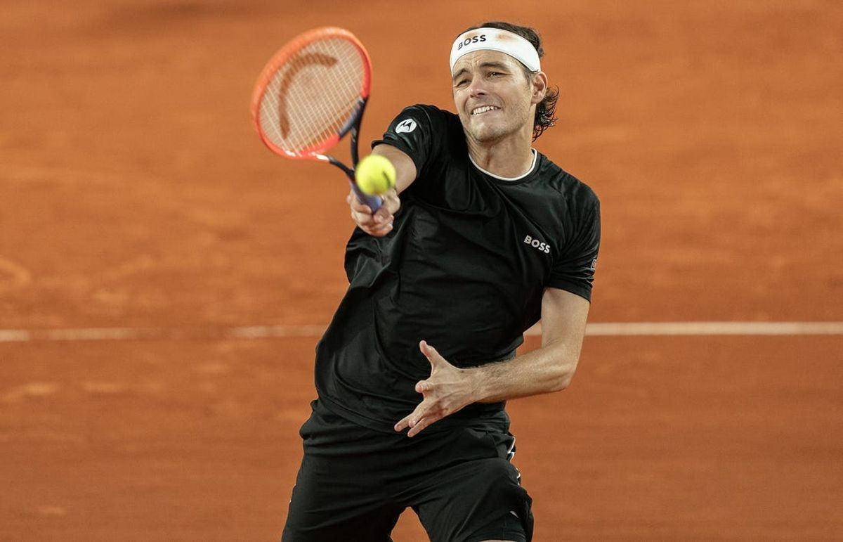 Jun 3, 2024; Paris, France; Taylor Fritz of the United States returns a shot during his match against Casper Ruud of Norway on day nine of Roland Garros at Stade Roland Garros. Mandatory Credit: Susan Mullane-USA TODAY Sports