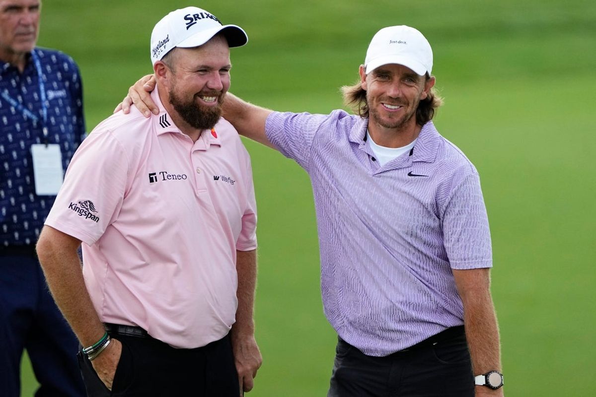 Jun 3, 2024; Columbus, Ohio, USA; Shane Lowry and Tommy Fleetwood embrace on 18 during a practice round for the Memorial Tournament at Muirfield Village Golf Club.