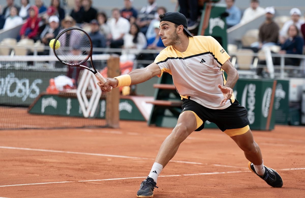 Jun 3, 2024; Paris, France; Francisco Cerundolo of Argentina returns a shot during his match against Novak Djokovic of Serbia on day nine of Roland Garros at Stade Roland Garros. Mandatory Credit: Susan Mullane-USA TODAY Sports