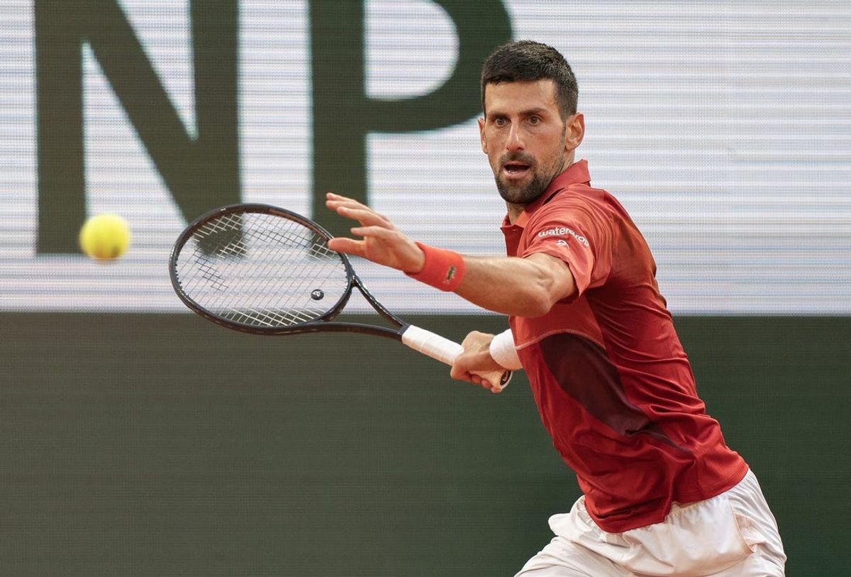 Jun 3, 2024; Paris, France; Novak Djokovic of Serbia returns a shot during his match against Francisco Cerundolo of Argentina on day nine of Roland Garros at Stade Roland Garros. Mandatory Credit: Susan Mullane-USA TODAY Sports