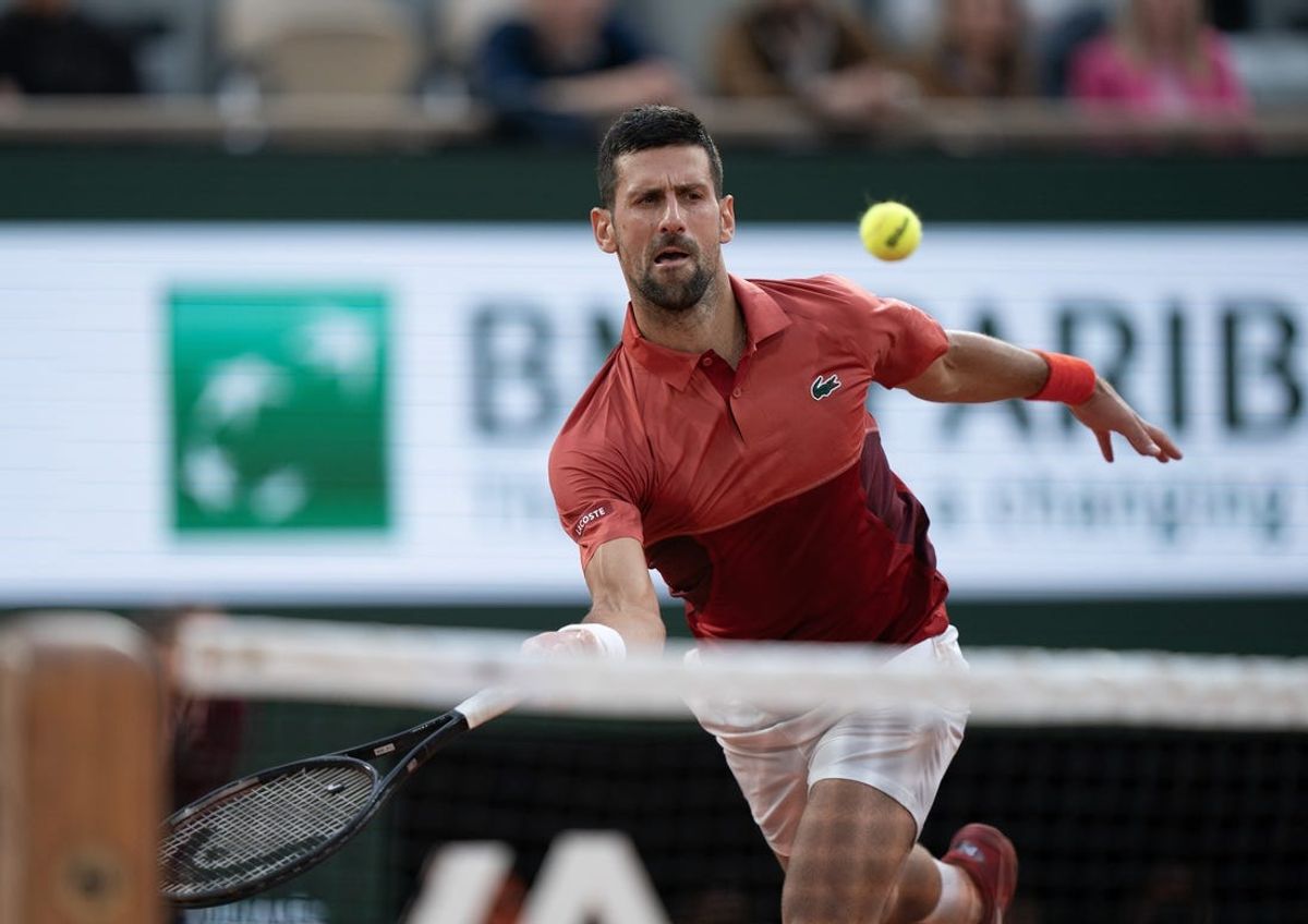 Jun 3, 2024; Paris, France; Novak Djokovic of Serbia returns a shot during his match against Francisco Cerundolo of Argentina on day nine of Roland Garros at Stade Roland Garros. Mandatory Credit: Susan Mullane-USA TODAY Sports