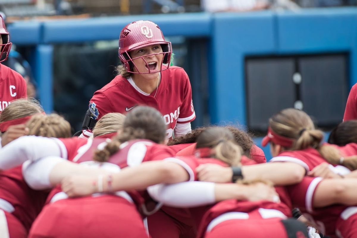 Jun 3, 2024;  Oklahoma City, OK, USA;  Oklahoma Sooners outfielder Jayda Coleman (24) yells to her players in a circle before the start of a Women's College World Series softball semifinal game against against the Florida Gators at Devon Park. Mandatory Credit: Brett Rojo-USA TODAY Sports