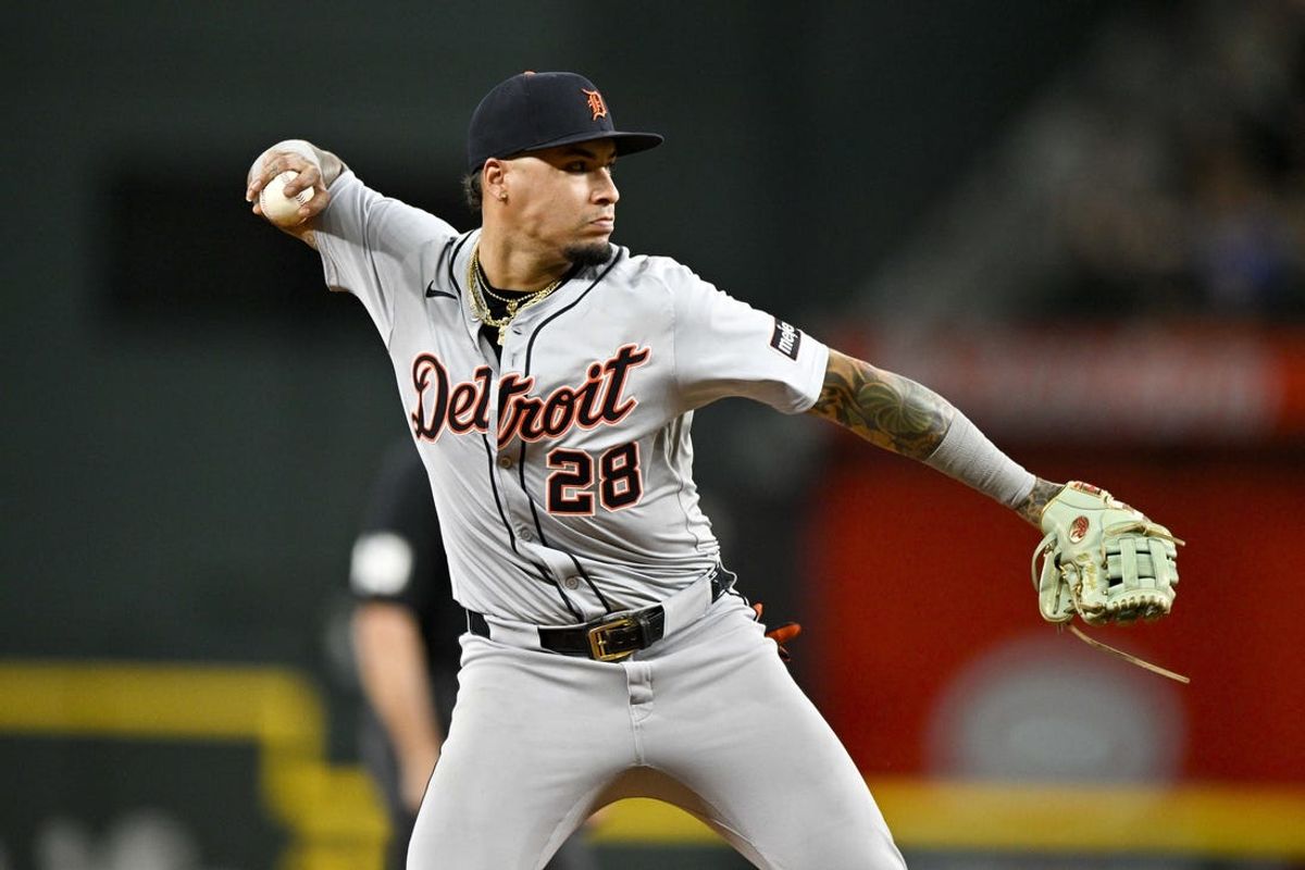 Jun 3, 2024; Arlington, Texas, USA; Detroit Tigers shortstop Javier Baez (28) throws to first base during the fourth inning against the Texas Rangers at Globe Life Field. Mandatory Credit: Jerome Miron-USA TODAY Sports