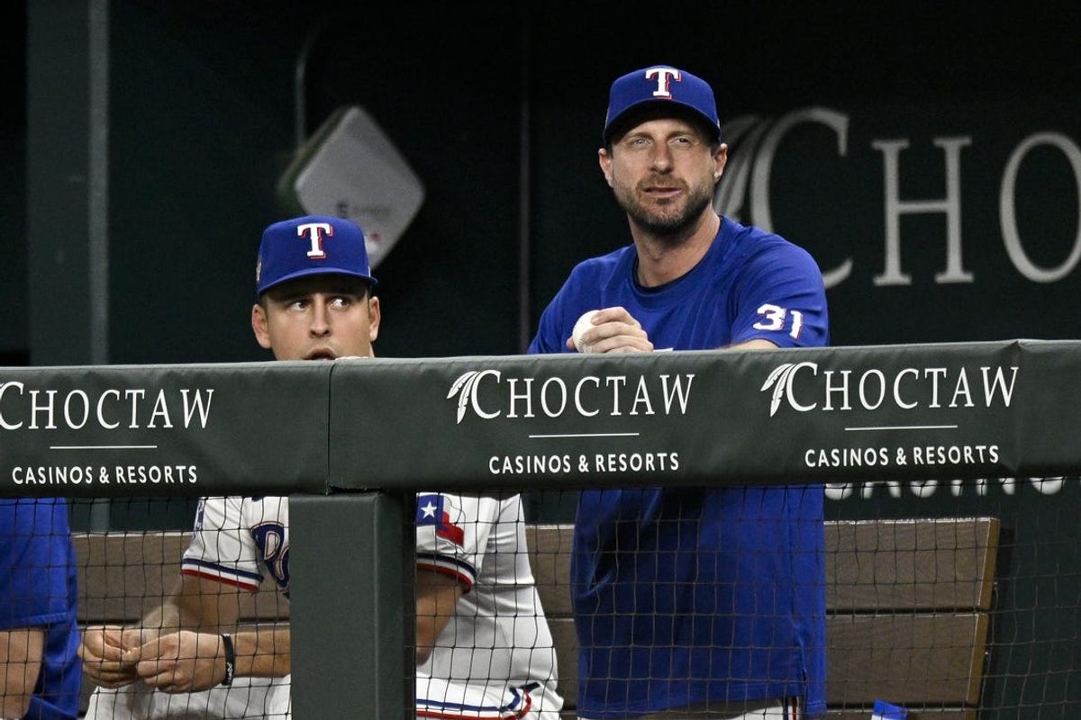 Jun 3, 2024; Arlington, Texas, USA; Texas Rangers starting pitcher Max Scherzer (31) watches from the dugout during the sixth inning against the Detroit Tigers at Globe Life Field. Mandatory Credit: Jerome Miron-USA TODAY Sports