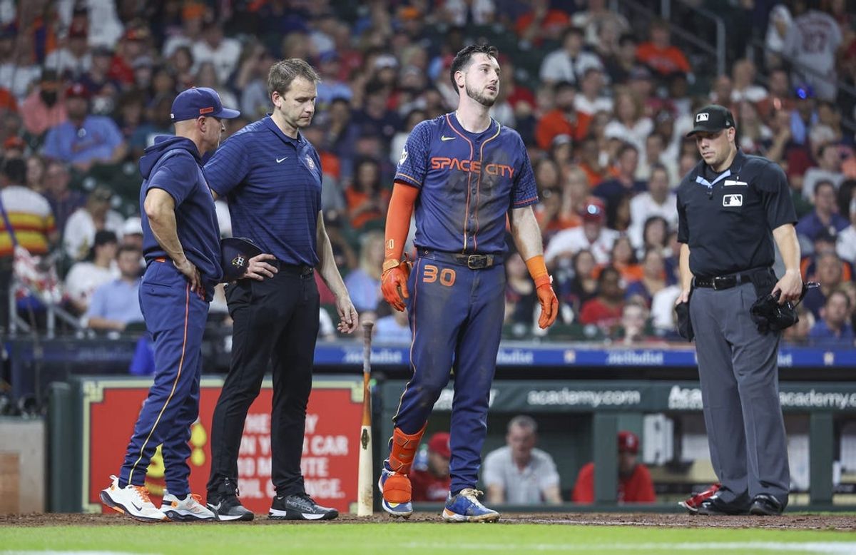 Jun 3, 2024; Houston, Texas, USA; Houston Astros right fielder Kyle Tucker (30) attempts to walk after an apparent injury during the third inning against the St. Louis Cardinals at Minute Maid Park. Mandatory Credit: Troy Taormina-USA TODAY Sports