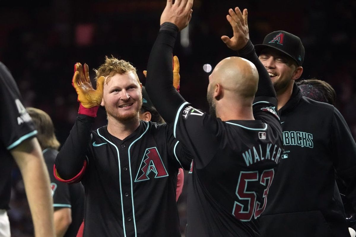 Jun 3, 2024; Phoenix, Arizona, USA; Arizona Diamondbacks outfielder Pavin Smith (26) celebrate with teammates after hitting a two run home run against the San Francisco Giants in the ninth inning at Chase Field. Mandatory Credit: Rick Scuteri-USA TODAY Sports
