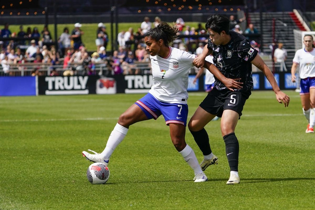 Jun 1, 2024; Commerce City, Colorado, USA;  US Women’s National Team midfielder Catarina Macario (7) battles for the ball with GO Yuna (5) of Korea Republic at Dick's Sporting Goods Park. Mandatory Credit: Michael Madrid-USA TODAY Sports