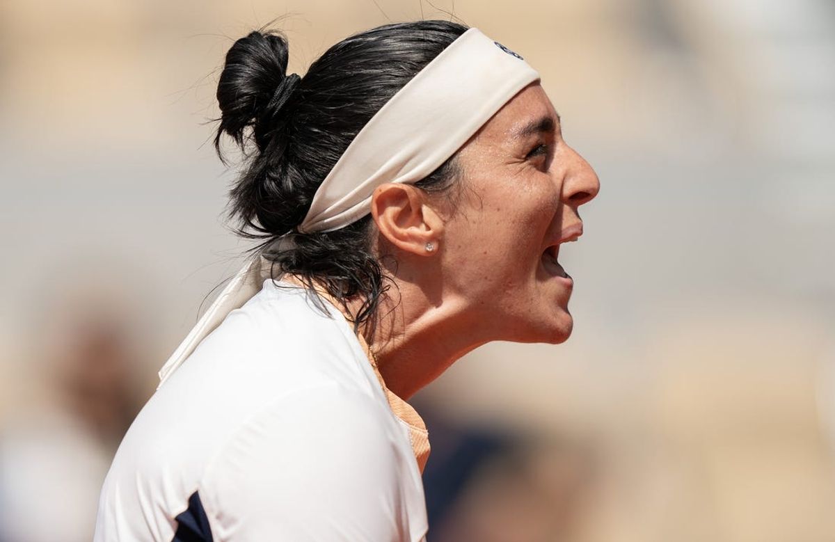 Jun 4, 2024; Paris, France; Ons Jabeur of Tunisia reacts to a point during her match against Coco Gauff of the United States on day 10 of Roland Garros at Stade Roland Garros. Mandatory Credit: Susan Mullane-USA TODAY Sports