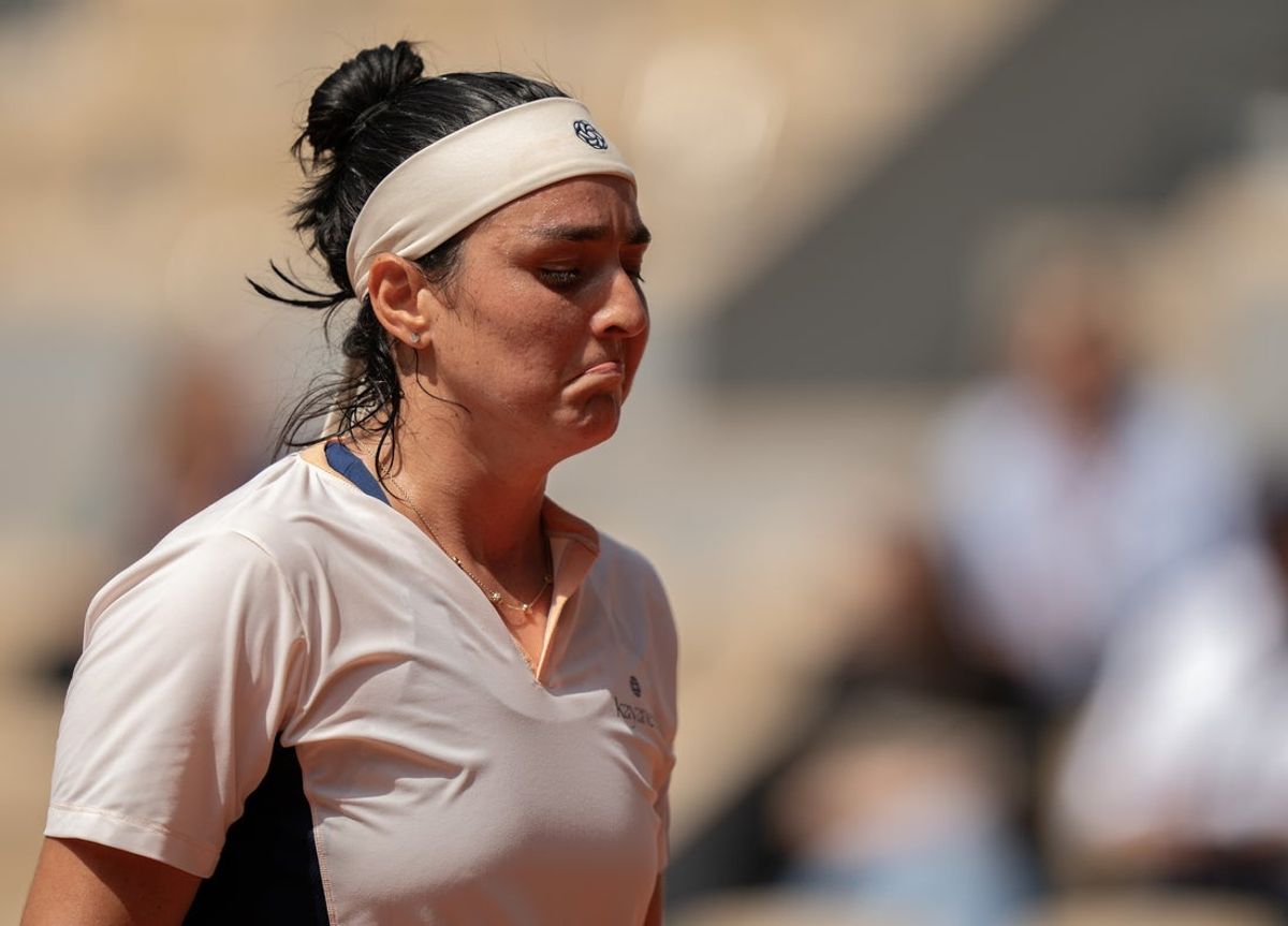 Jun 4, 2024; Paris, France; Ons Jabeur of Tunisia reacts to a point during her match against Coco Gauff of the United States on day 10 of Roland Garros at Stade Roland Garros. Mandatory Credit: Susan Mullane-Imagn Images
