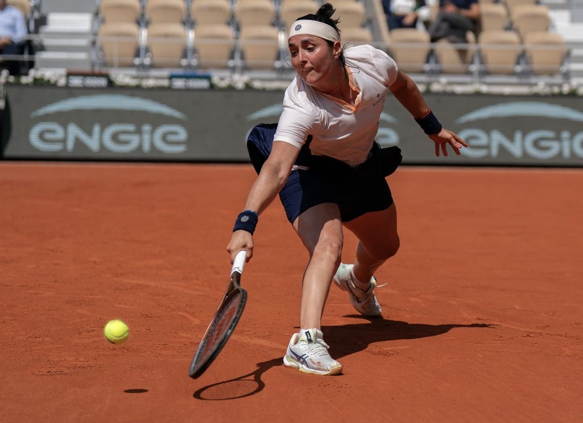 Jun 4, 2024; Paris, France; Ons Jabeur of Tunisia returns a shot during her match against Coco Gauff of the United States on day 10 of Roland Garros at Stade Roland Garros. Mandatory Credit: Susan Mullane-USA TODAY Sports